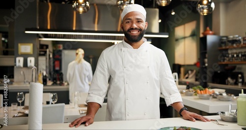 Man, head chef and portrait in kitchen for business, happy and smile in food restaurant with confidence. Culinary skills, hospitality industry and professional gastronomy, cook and service staff