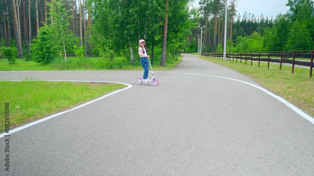 Cute Little Child Girl Enjoy Ride Kick Scooter Outdoor.Little Girl Riding On Scooter.Funny Adorable Happy Kid Girl Playing On Park. Cute Little Child Girl Enjoy Ride Kick Scooter Outdoor.Little Girl Riding On Scooter.Funny Adorable Happy Kid Girl Playing On Park.
