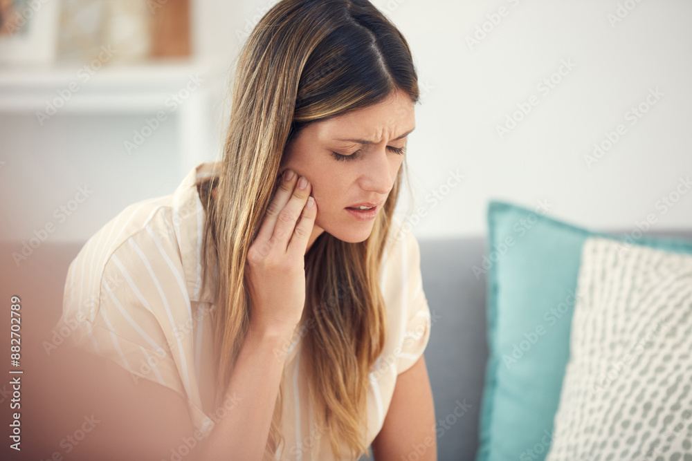 Living room, sofa and woman with mouth in pain for dental inflammation, problem or discomfort of cavity. Home, frustrated and person with sensitive tooth for wisdom teeth, emergency or oral infection Living room, sofa and woman with mouth in pain for dental inflammation, problem or discomfort of cavity. Home, frustrated and person with sensitive tooth for wisdom teeth, emergency or oral infection