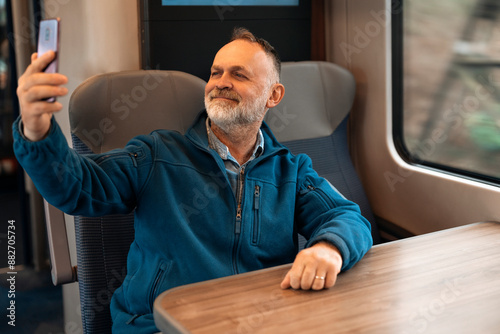 Happy Man Taking Selfie While Riding Train