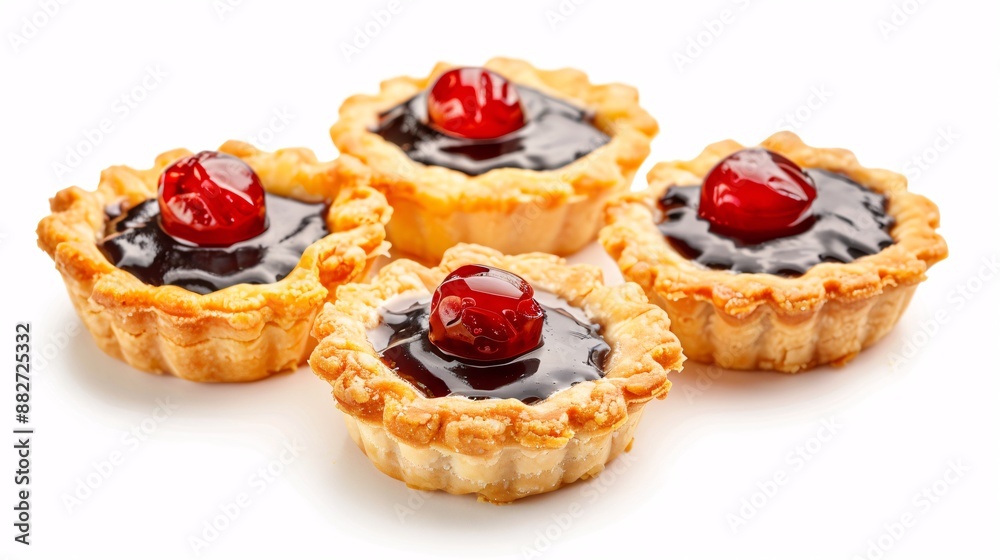 Handmade mini pies on a blank backdrop. Handmade mini pies on a blank backdrop.