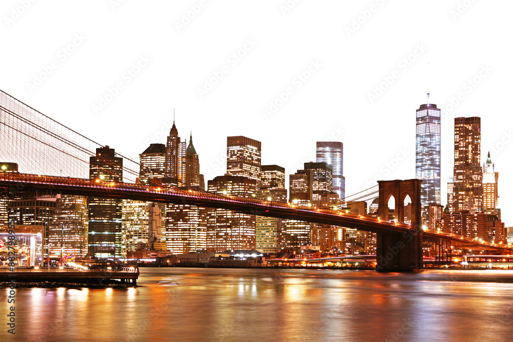 Fototapeta premium A vibrant night view of Manhattan skyline with the Brooklyn Bridge, illuminated buildings, and reflections on water