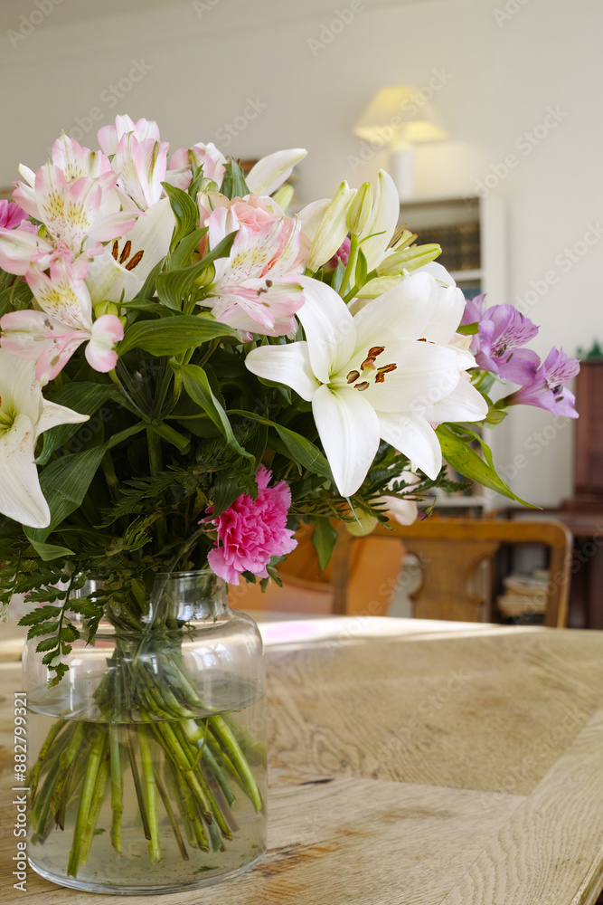 Lily, bouquet and bunch of flowers, house and nature of plants, spring and celebration for valentines day. Decoration, petals and textures of table, leaves and blossom of vase and water in home Lily, bouquet and bunch of flowers, house and nature of plants, spring and celebration for valentines day. Decoration, petals and textures of table, leaves and blossom of vase and water in home