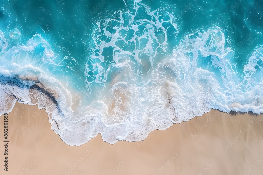 Aerial View of Turquoise Waves Crashing onto a Sandy Beach Aerial View of Turquoise Waves Crashing onto a Sandy Beach