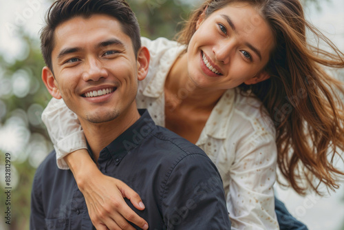 Portrait of happy Asian love couple in city. They are both happy and enjoying the moment © polack