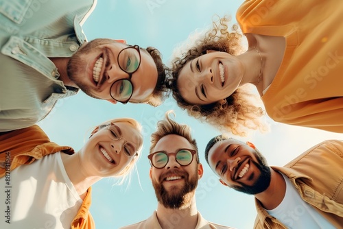 Diverse group of cheerful young adults smiling together in relaxed indoor setting