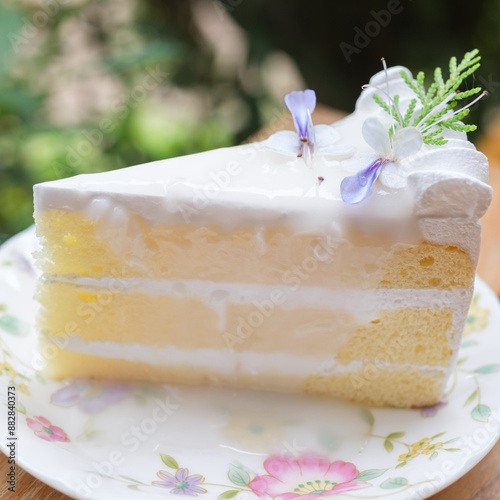 Sliced of coconut  cake on white plate