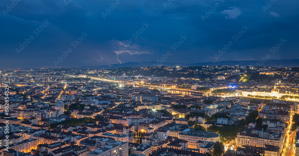 Fototapeta premium Lyon city at night thunderstorm