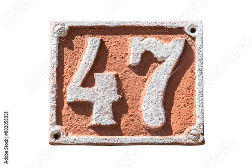 Fotografía Old retro weathered cast iron plate with number 47 isolated on white background