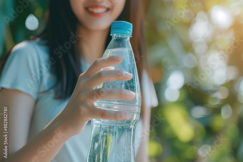 Fitness and Hydration: Woman with Mineral Water Bottle