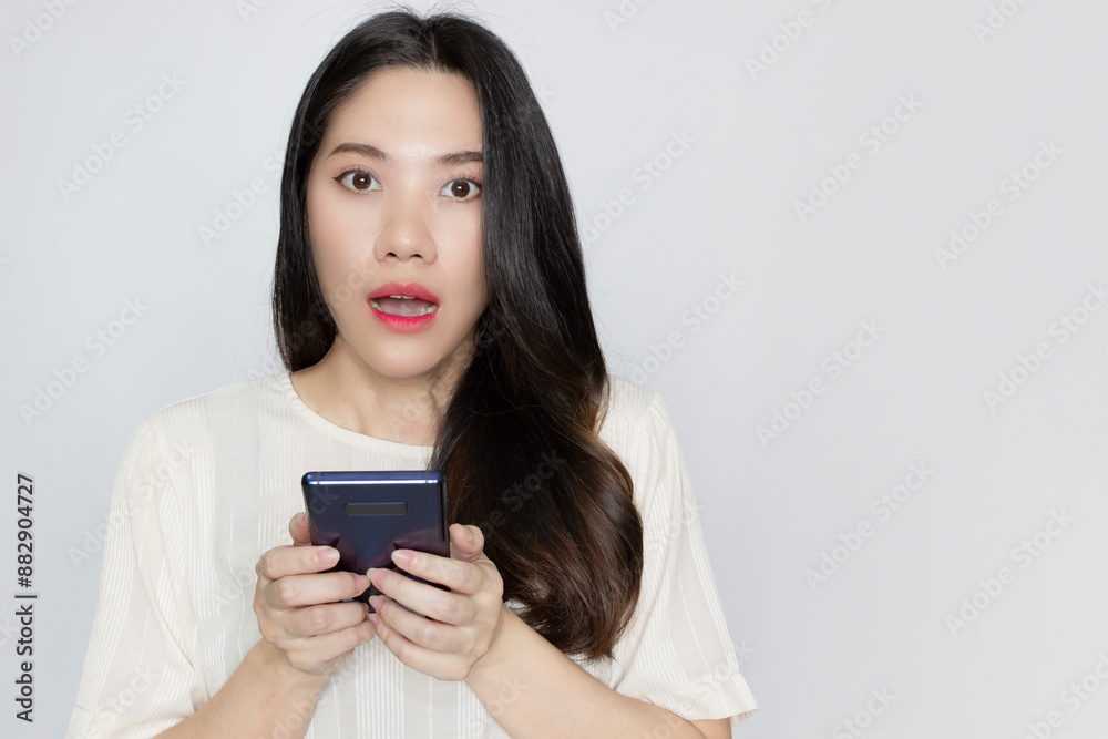 woman hold smartphone with shocked and surprised with promotion , advertisement. woman hold smartphone with shocked and surprised with promotion , advertisement.