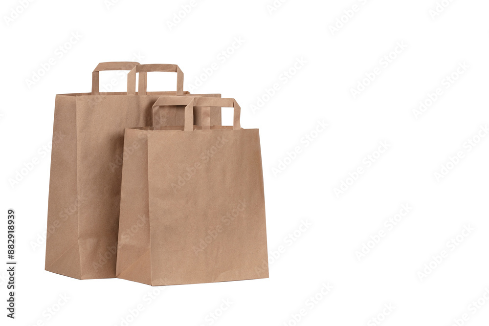 Eco-Friendly Brown Kraft Paper Shopping Bag with Handles Isolated on White Background for Sustainable Retail Packaging and Branding Mockups Eco-Friendly Brown Kraft Paper Shopping Bag with Handles Isolated on White Background for Sustainable Retail Packaging and Branding Mockups