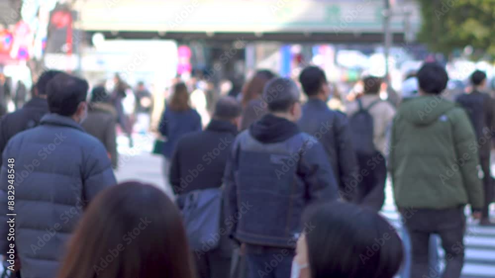 Large crowds of people walking Shibuya's scramble crossing Tokyo Large crowds of people walking Shibuya's scramble crossing Tokyo