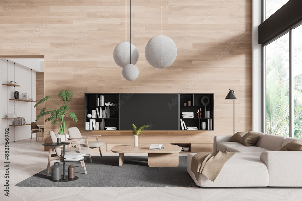 Obraz premium Wooden home living room interior with sofa and armchair, panoramic window