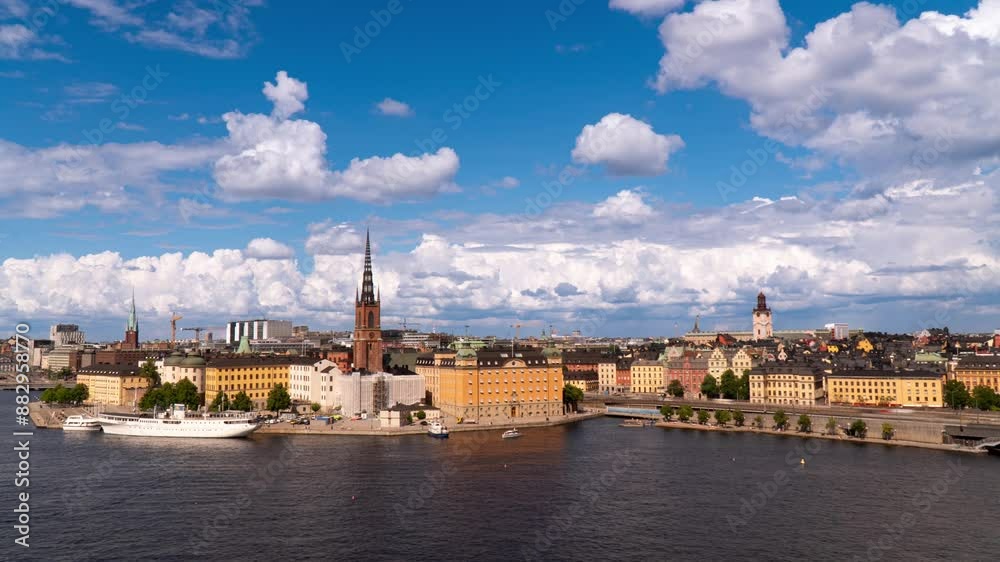 Time lapse of Stockholm, Old town and Riddarholmen, bright daylight, cumulus clouds, blue sky, summer Time lapse of Stockholm, Old town and Riddarholmen, bright daylight, cumulus clouds, blue sky, summer