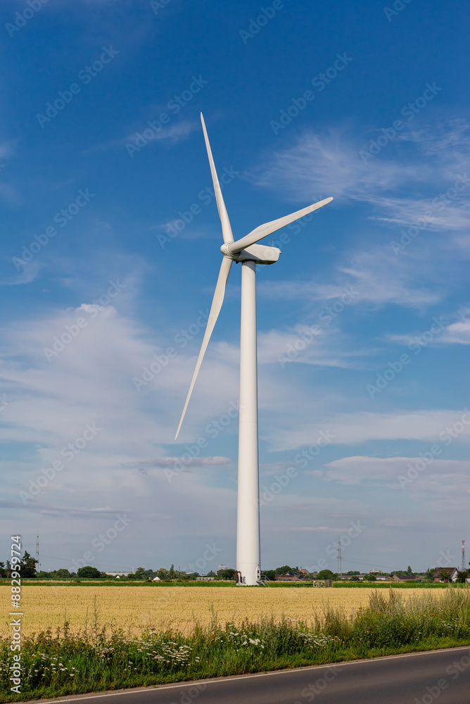 wind generators in a field on a sunny day. alternative energy. wind generators in a field on a sunny day. alternative energy.