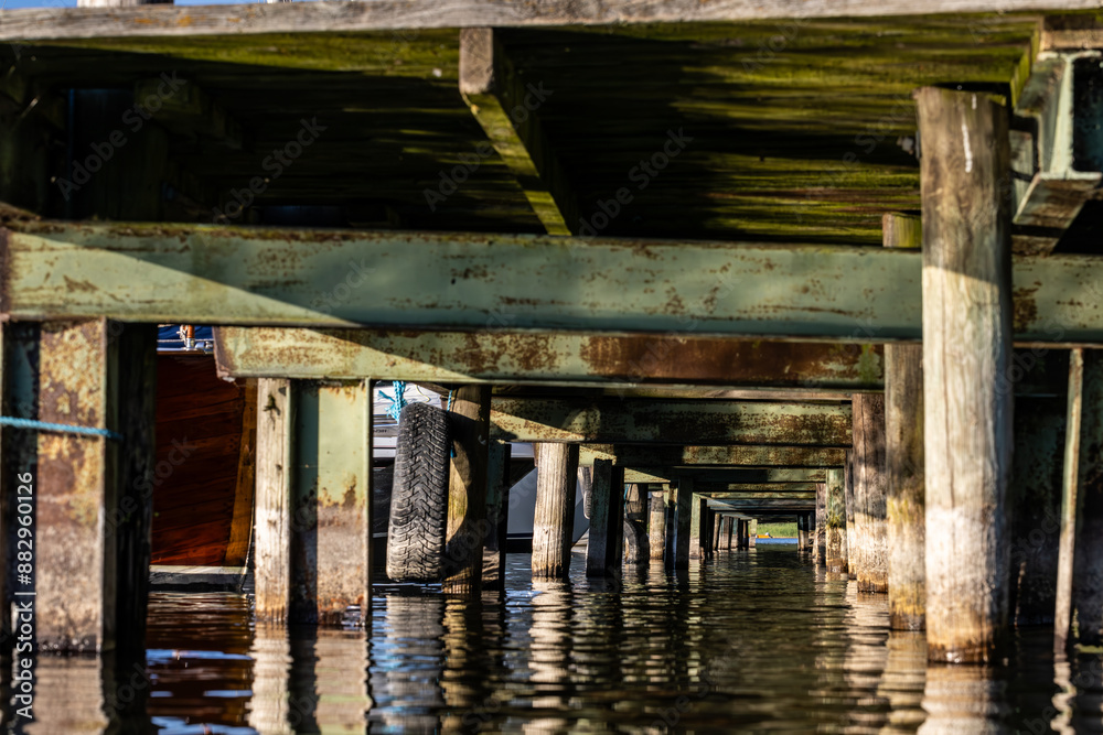 Stockholm, Sweden An underside or water-level view of a wooden dock on Lake Malaren. Stockholm, Sweden An underside or water-level view of a wooden dock on Lake Malaren.