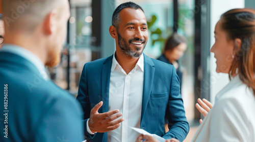 Wallpaper Mural Business Professionals Engaging in a Lively Discussion in a Modern Office Environment Torontodigital.ca
