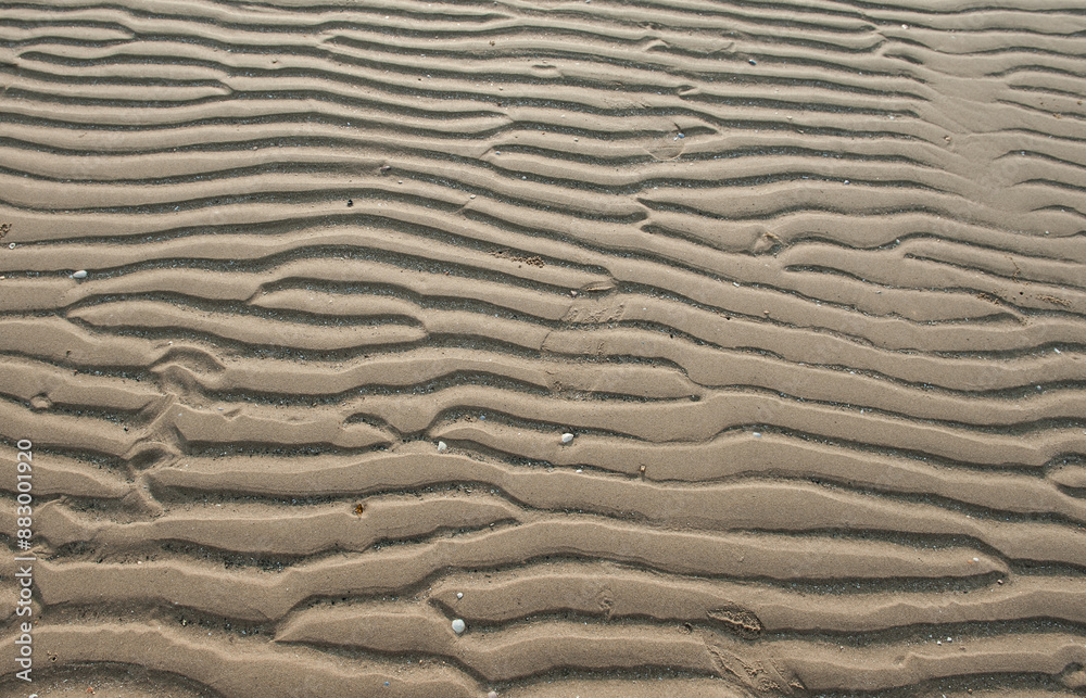 Traces of sand patterns on the beach Traces of sand patterns on the beach