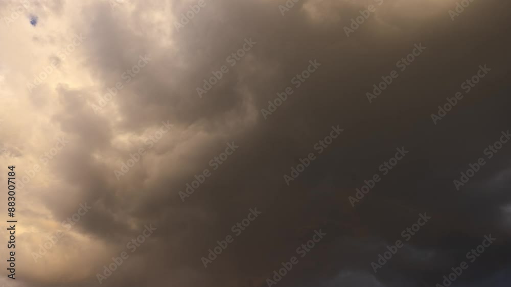 The weather changes from stormy clouds to clear blue evening skies. A little bit of rainbow. Time lapse.