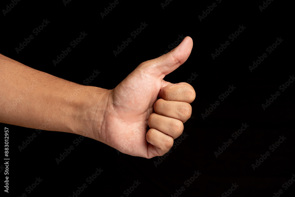 Latin man's hands making shapes. hand with thumb up Latin man's hands making shapes. hand with thumb up