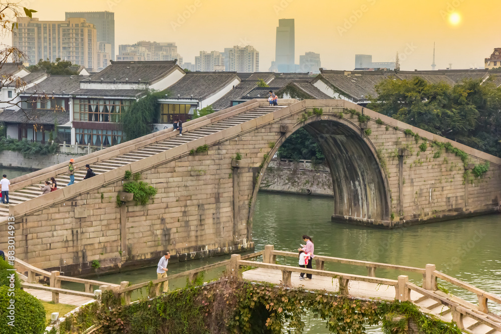 Sunset over the historic Wumen bridge in Panmen scenic area in Suzhou, China