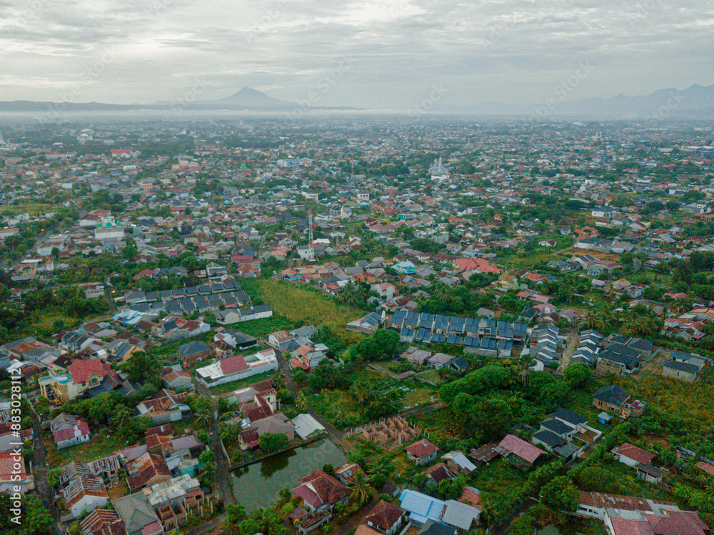 Fototapeta premium Aerial drone view of big city skyline scenery in Banda Aceh, Aceh, Indonesia.