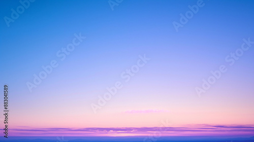 Vibrant beautiful sunset sky with clouds in purple and pink hues.