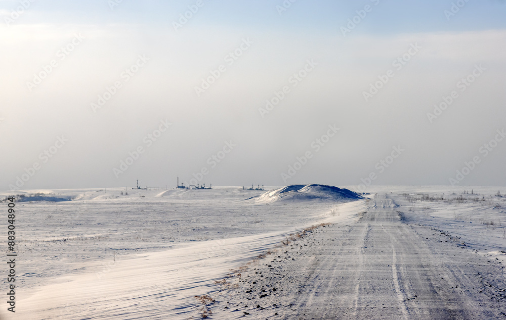 Ice road trucker in a remote area for trucks. A road built in the tundra for the needs of the Russian oil and gas industry. Ice road trucker in a remote area for trucks. A road built in the tundra for the needs of the Russian oil and gas industry.