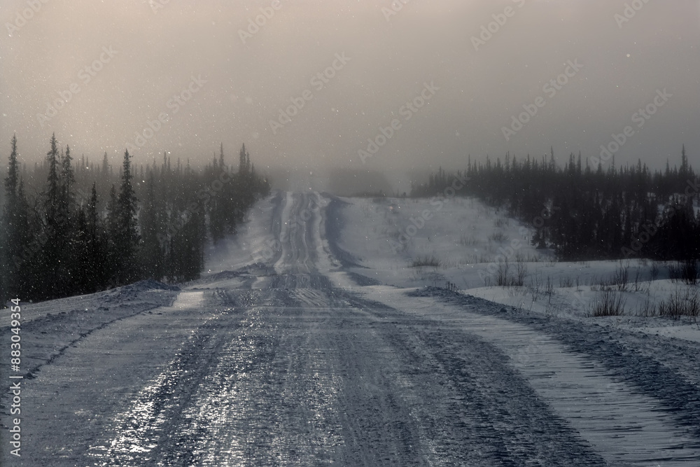 Ice road trucker in a remote area for trucks. A road built in the tundra for the needs of the Russian oil and gas industry. Ice road trucker in a remote area for trucks. A road built in the tundra for the needs of the Russian oil and gas industry.