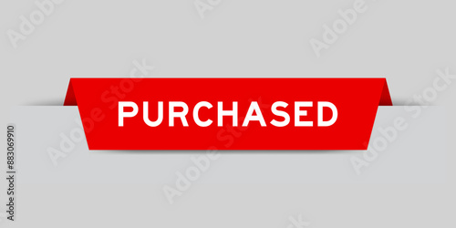 Red color inserted label with word purchased on gray background