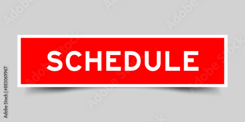 Square sticker label with word schedule in red color on gray background