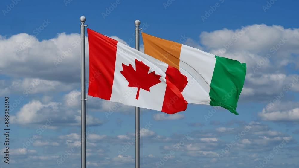 Ivory Coast or Cote d'Ivoire and Canada flags flying together, video concept of the relationship, two country cooperation concept