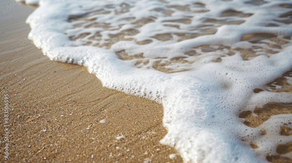 Tranquil Seafoam Patterns on Beach Sand at Low Tide