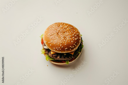 clse up horizontal isolated image of a burger on a neutral background, view from above, copy space photo