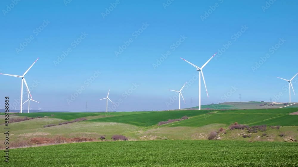 wind turbines generating energy from the wind, in nature, clear blue sky wind turbines generating energy from the wind, in nature, clear blue sky