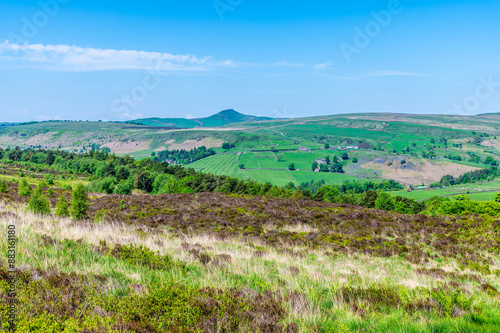 A view over heather covered hillside close to Luds Church near Gradbach, Staffordshire in summertime photo