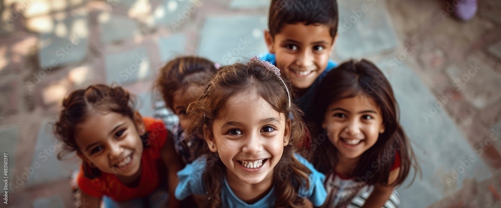 A group of children, sitting in a circle, their faces beaming with happiness A group of children, sitting in a circle, their faces beaming with happiness