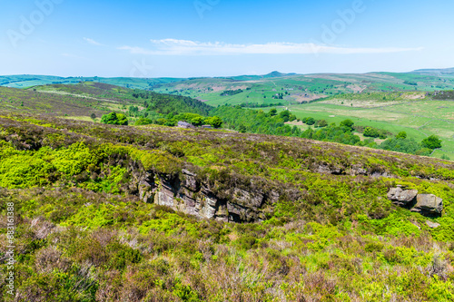 A view across the hillside towards Luds Church near Gradbach, Staffordshire in summertime photo