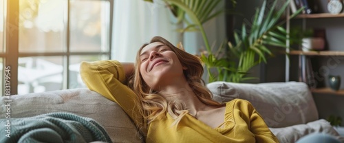 A happy tenant, moving into a new home, resting and breathing the fresh air, her face filled with relief