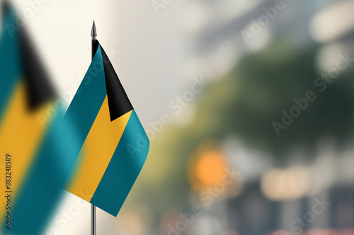 Small flags of Bahamas on a blurred background