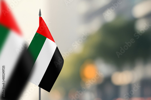 Small flags of United Arab Emirates on a blurred background photo