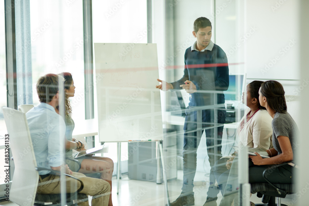 Business people, presentation and man in meeting, feedback and brainstorming for project. Group, employees and presenter with confidence, diversity and leadership with review, workshop and coaching