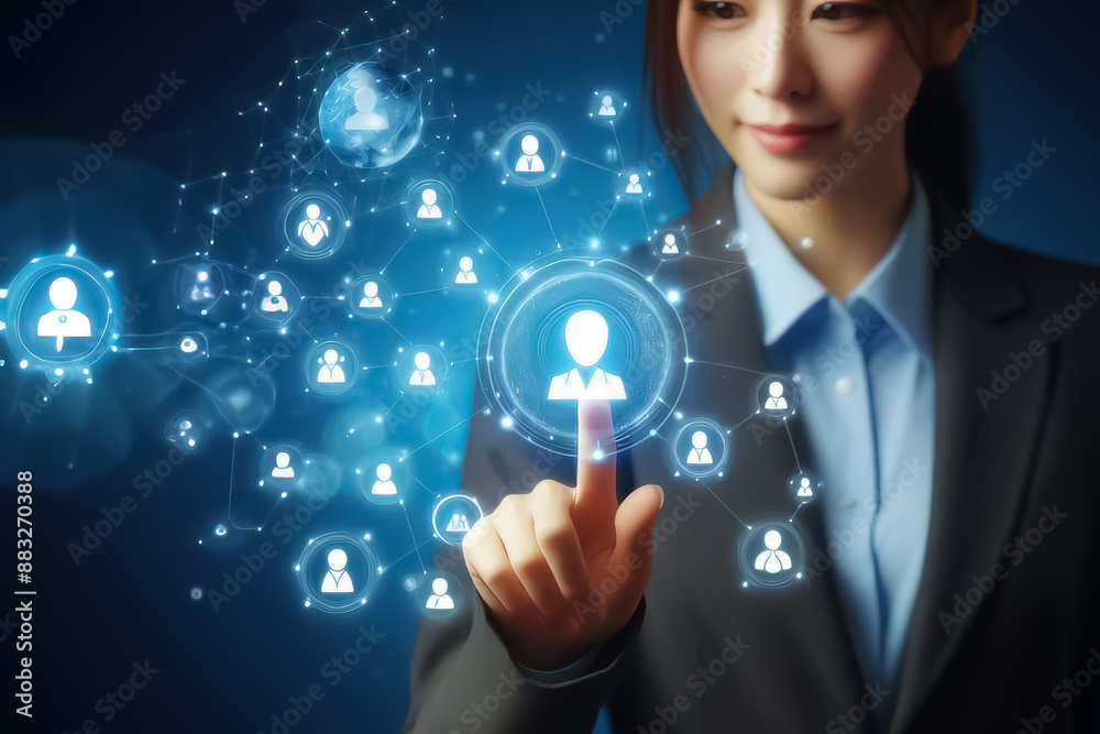 Business woman touching virtual icon customers of social network on blue screen Business woman touching virtual icon customers of social network on blue screen
