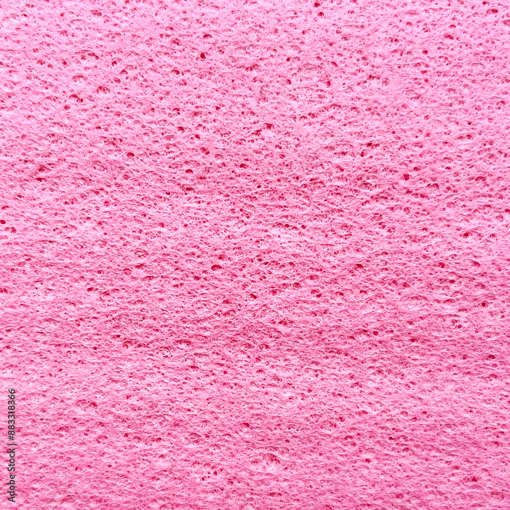 Texture of a synthetic pink kitchen rag close up