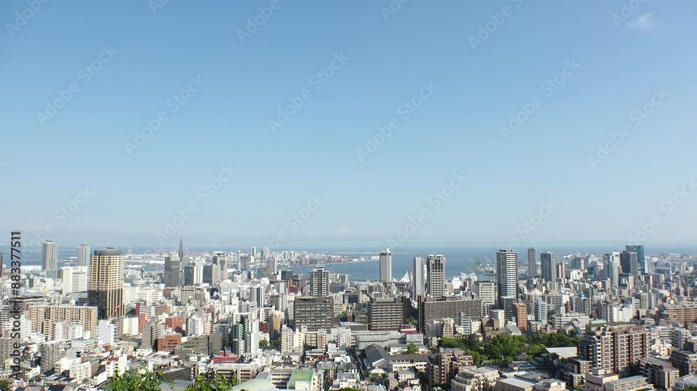 KOBE, HYOGO, JAPAN - JUNE 2024 : Aerial high angle view of Kobe city and Kobe port in daytime. View of buildings and street around Kobe port tower and Sannomiya station. KOBE, HYOGO, JAPAN - JUNE 2024 : Aerial high angle view of Kobe city and Kobe port in daytime. View of buildings and street around Kobe port tower and Sannomiya station.