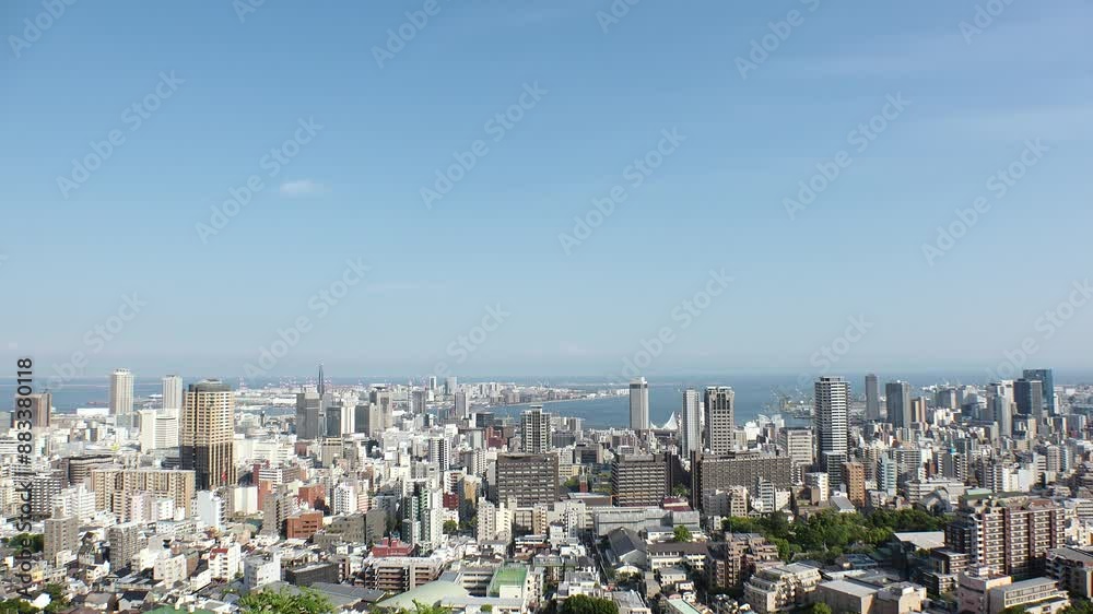 KOBE, HYOGO, JAPAN - JUNE 2024 : Aerial high angle view of Kobe city and Kobe port in daytime. View of buildings and street around Kobe port tower and Sannomiya station. 4K time lapse shot. KOBE, HYOGO, JAPAN - JUNE 2024 : Aerial high angle view of Kobe city and Kobe port in daytime. View of buildings and street around Kobe port tower and Sannomiya station. 4K time lapse shot.