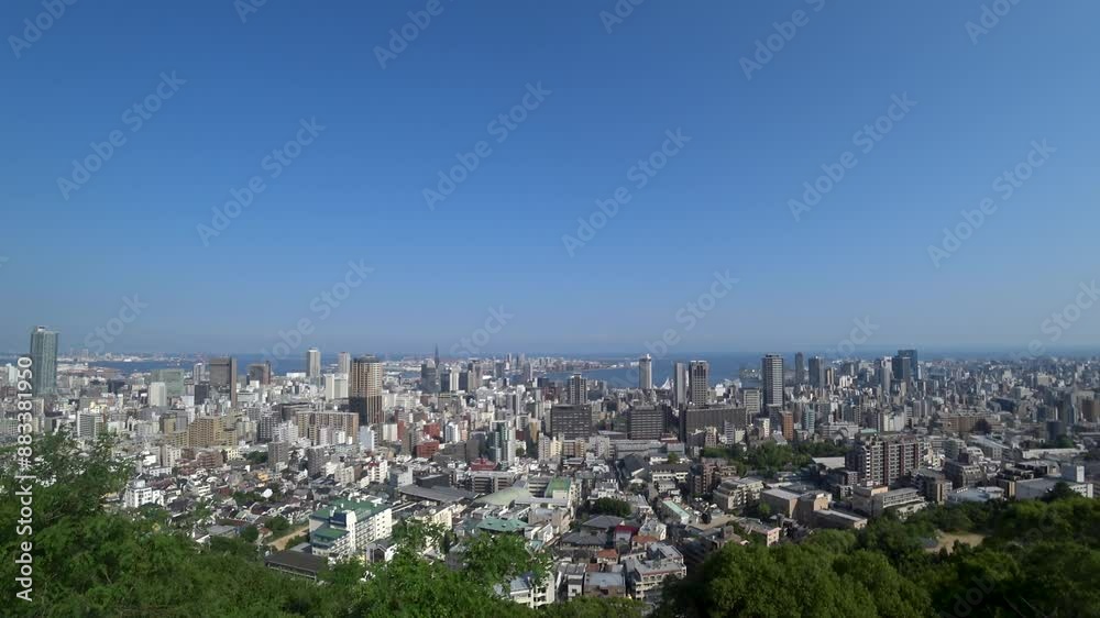 KOBE, HYOGO, JAPAN - JUNE 2024 : Aerial high angle view of Kobe city and Kobe port in daytime. View of buildings and street around Kobe port tower and Sannomiya station. 4K time lapse shot. KOBE, HYOGO, JAPAN - JUNE 2024 : Aerial high angle view of Kobe city and Kobe port in daytime. View of buildings and street around Kobe port tower and Sannomiya station. 4K time lapse shot.