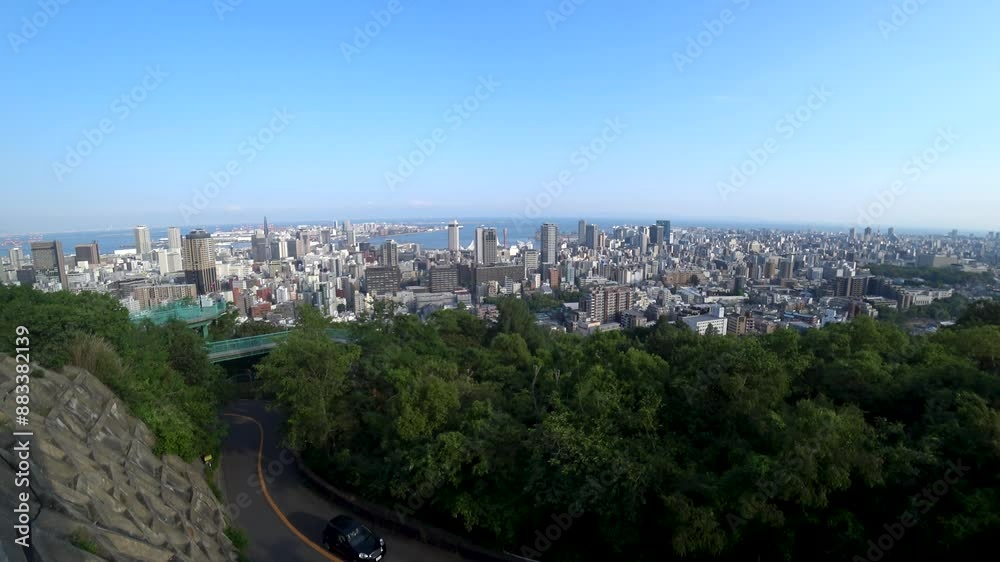 KOBE, HYOGO, JAPAN - JUNE 2024 : Aerial high angle view of Kobe city and Kobe port in daytime. View of buildings and street around Kobe port tower and Sannomiya station. 4K time lapse shot. KOBE, HYOGO, JAPAN - JUNE 2024 : Aerial high angle view of Kobe city and Kobe port in daytime. View of buildings and street around Kobe port tower and Sannomiya station. 4K time lapse shot.