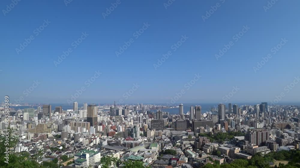 KOBE, HYOGO, JAPAN - JUNE 2024 : Aerial high angle view of Kobe city and Kobe port in daytime. View of buildings and street around Kobe port tower and Sannomiya station. 4K time lapse shot. KOBE, HYOGO, JAPAN - JUNE 2024 : Aerial high angle view of Kobe city and Kobe port in daytime. View of buildings and street around Kobe port tower and Sannomiya station. 4K time lapse shot.